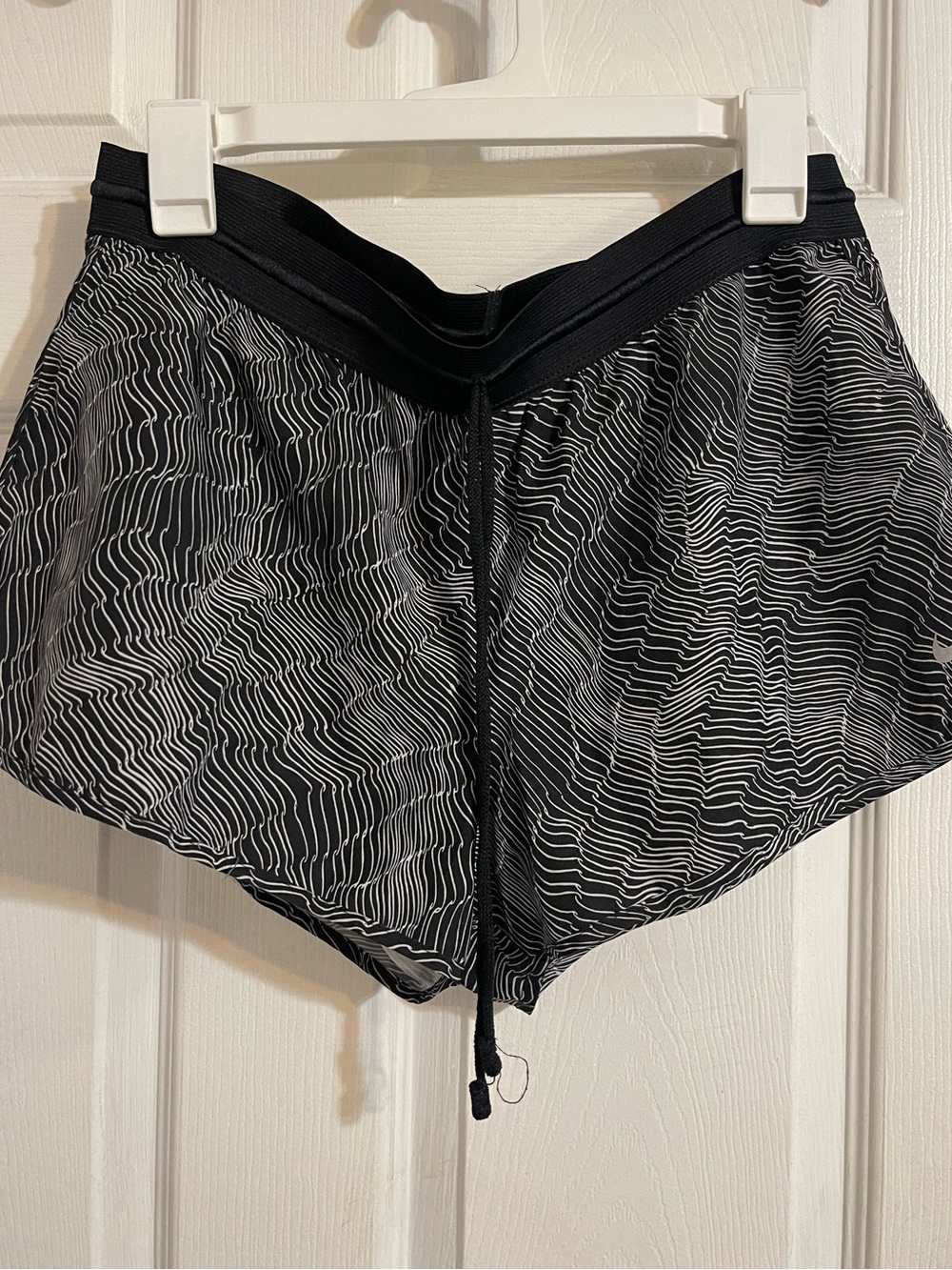 Nike Black Athletic Shorts with White Wave Lines